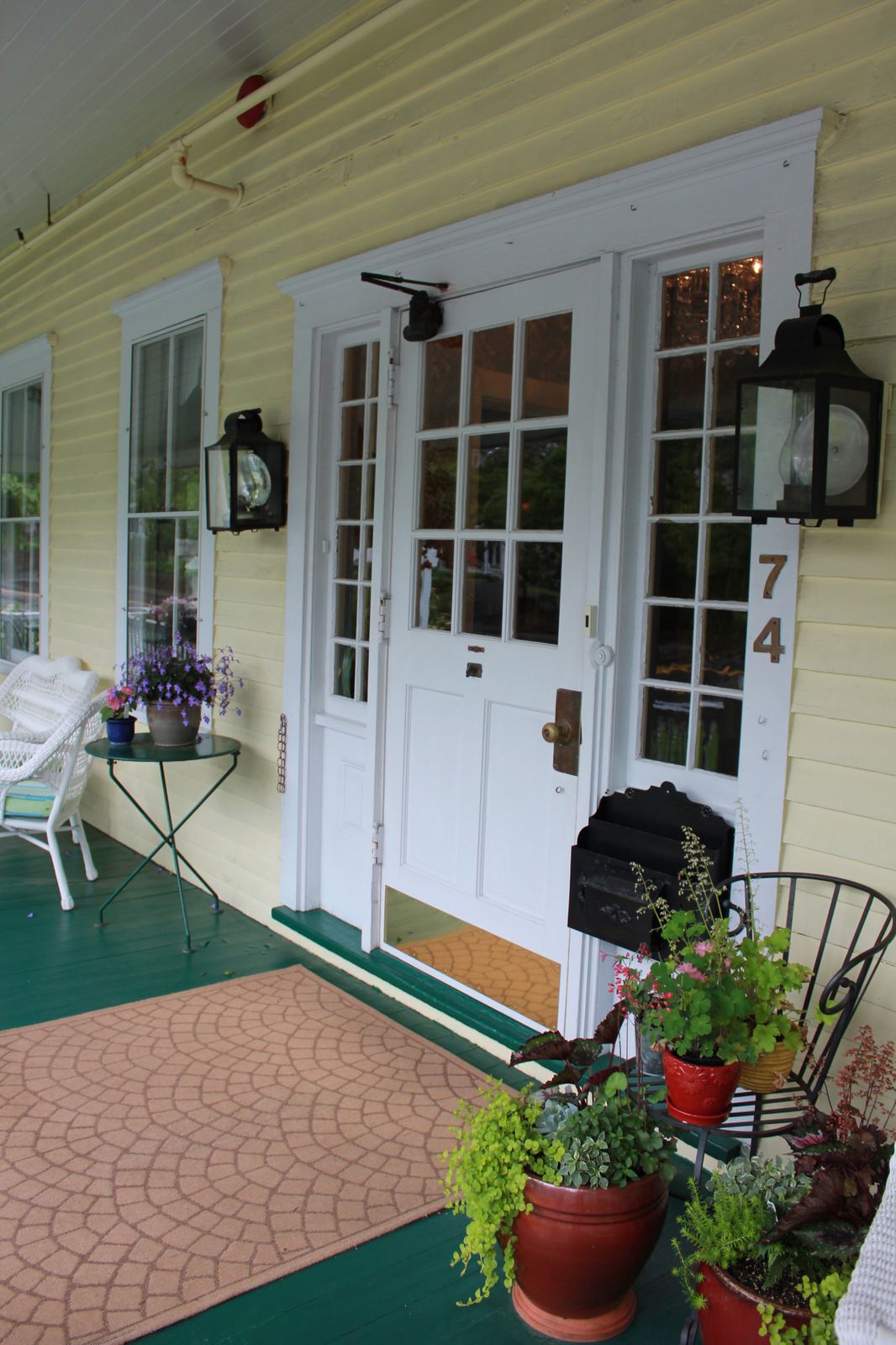 Front door of the yellow Victorian Holbrook House, number 74